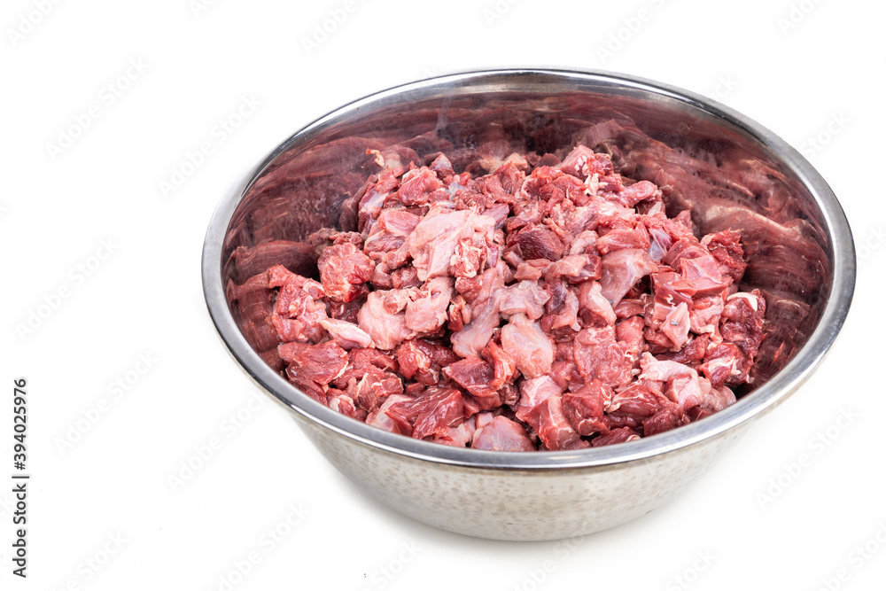 Chunks of raw beef. Barf raw meat diet preparation for dogs Chunks of raw beef. Barf raw meat diet preparation for dogs
