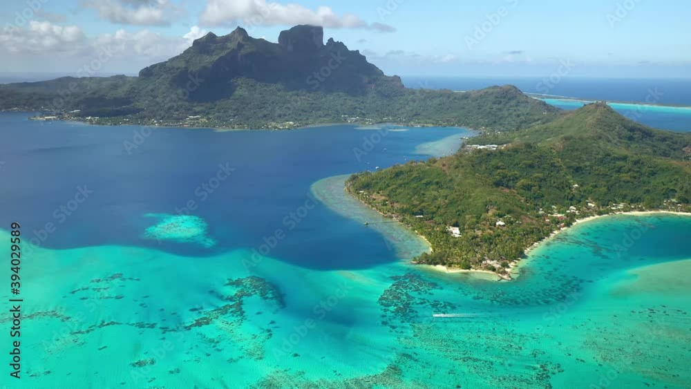 Drone aerial view Bora Bora Tahiti, 4k. Tropical paradise island, turquoise crystal clear water lagoon, overwater bungalows. French Polynesia. Drone aerial view Bora Bora Tahiti, 4k. Tropical paradise island, turquoise crystal clear water lagoon, overwater bungalows. French Polynesia.