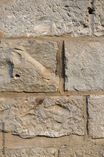 Vertical of barnstone wall texture photo