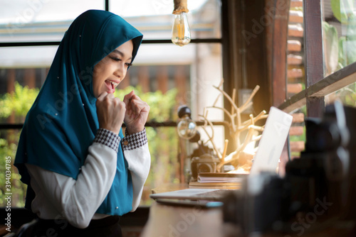 Muslim young woman hands with laptop. working remotely at home. Concept of networking or remote work. Global business network. Online courses.