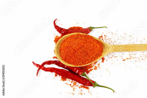 Fototapeta Naklejka Na Ścianę i Meble -  indian spice red chilli powder or mirchi powder with red chilli pepper on white background