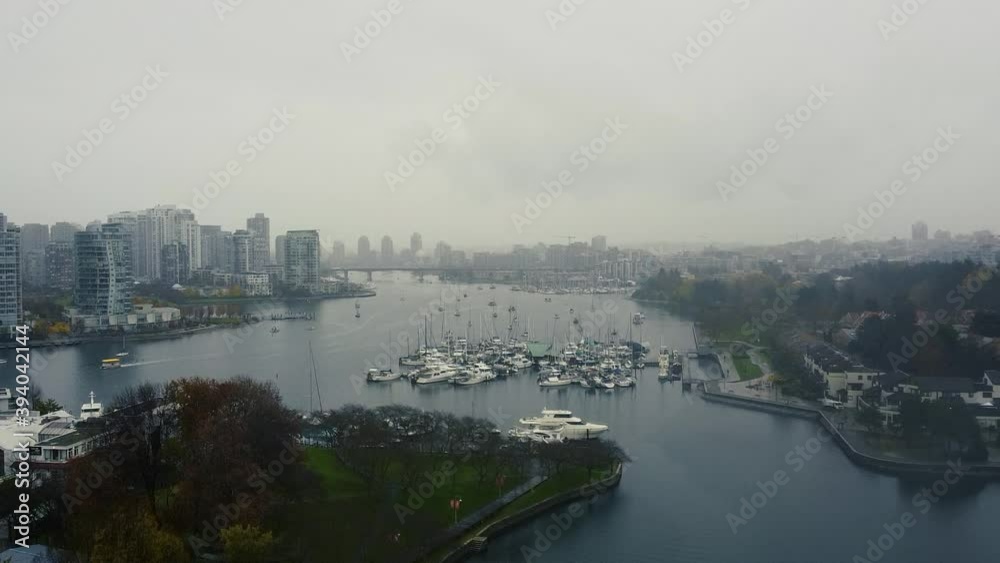 Fly over marina with sailing ships and moored yachts in Vancouver False Creek Fly over marina with sailing ships and moored yachts in Vancouver False Creek