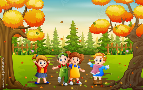Fototapeta Naklejka Na Ścianę i Meble -  Cartoon of many kids playing in autumn park
