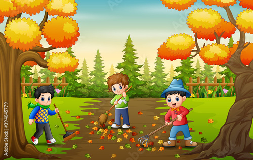 The volunteers cleaning up autumn leaves in the park