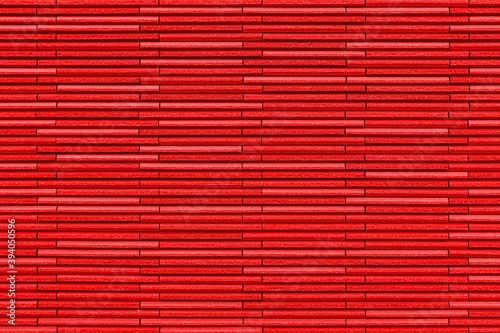 Modern Red stone wall with stripes texture and seamless background