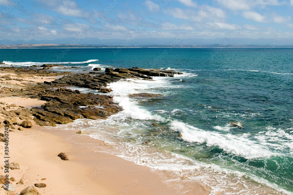 Beautiful beach in Mosselbay with blue sky in the background on the Famous Garden Road in South Africa Beautiful beach in Mosselbay with blue sky in the background on the Famous Garden Road in South Africa