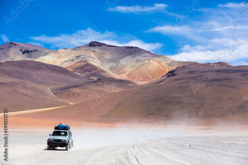 Off-road vehicle driving in the Atacama desert in Eduardo Avaroa Andean Fauna National Reserve, Bolivia photo