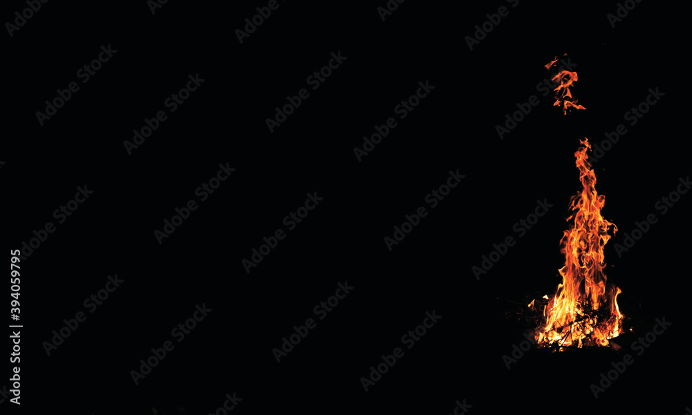 Minimalist Flames of fire on dark background wallpaper. Stock Photo