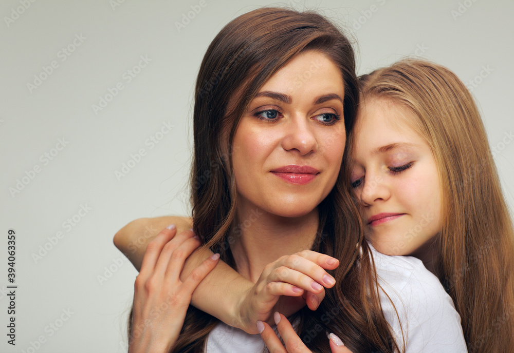 face portrait of young mother with teenager daughter looking away. face portrait of young mother with teenager daughter looking away.