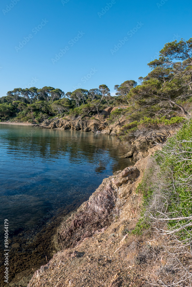 Discovery of the island of Porquerolles in summer. Deserted beaches and pine trees in this landscape of the French Riviera Discovery of the island of Porquerolles in summer. Deserted beaches and pine trees in this landscape of the French Riviera
