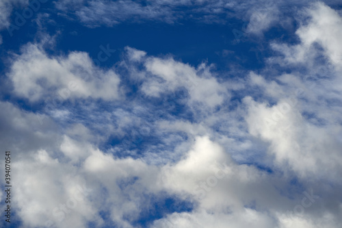Cumulus clouds against a dark blue sky  the cluster cloud is also known as a source cloud.