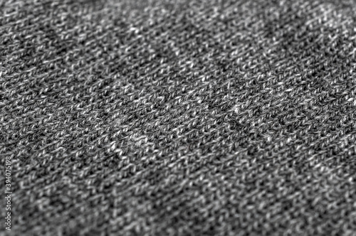 Grey knitted fabric texture. CLose up.
