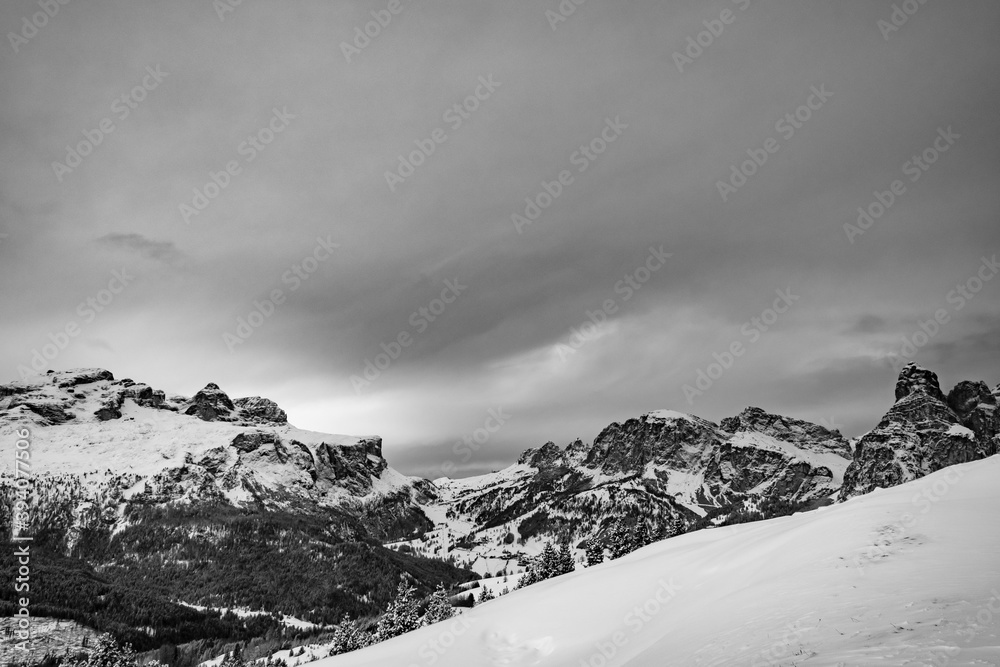 Stormy clouds in italian dolomites in a snowy winter