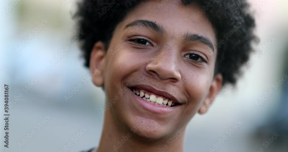 Mixed race young boy smiling at camera. Close-up portrait face Mixed race young boy smiling at camera. Close-up portrait face
