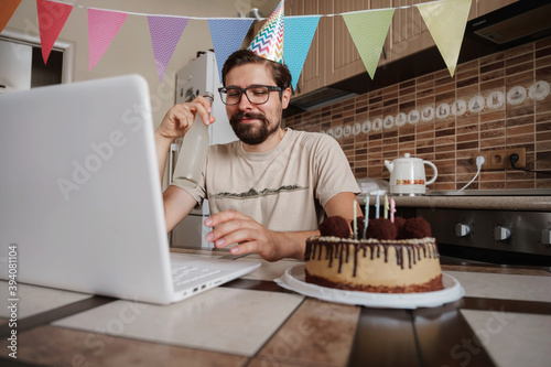 Man celebrating birthday online in quarantine time.