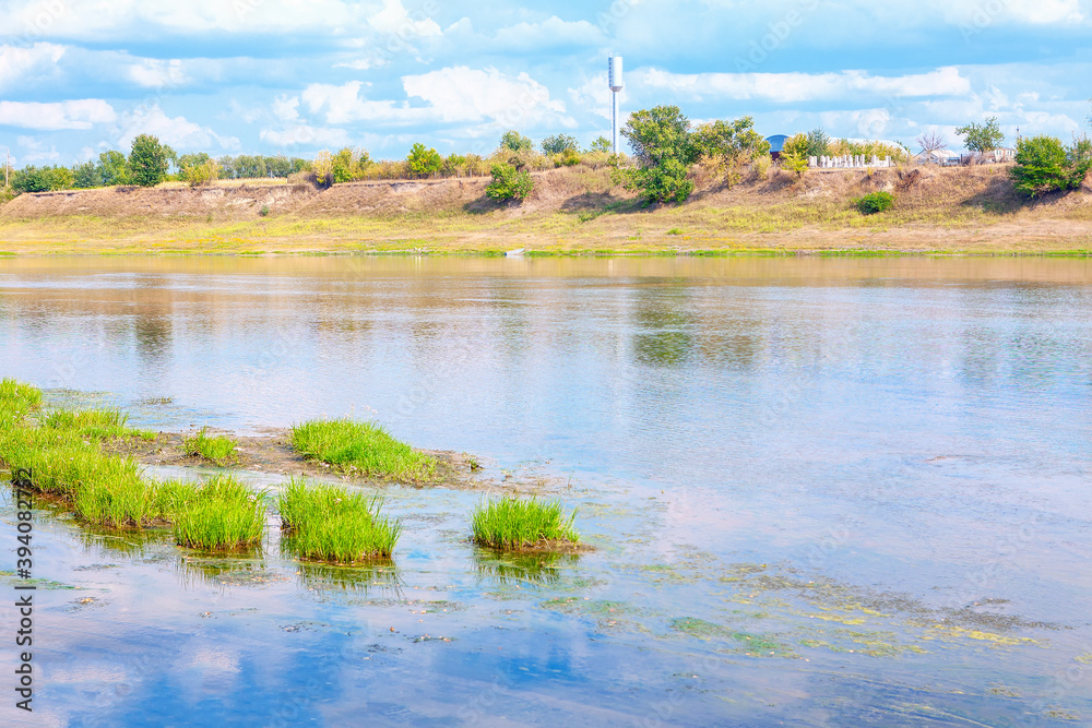 Natural scenery with riverside . Village situated on the river shore Natural scenery with riverside . Village situated on the river shore