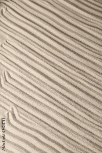 Sand surface texture with smooth lines and shadows, for relaxation and spiritual harmony