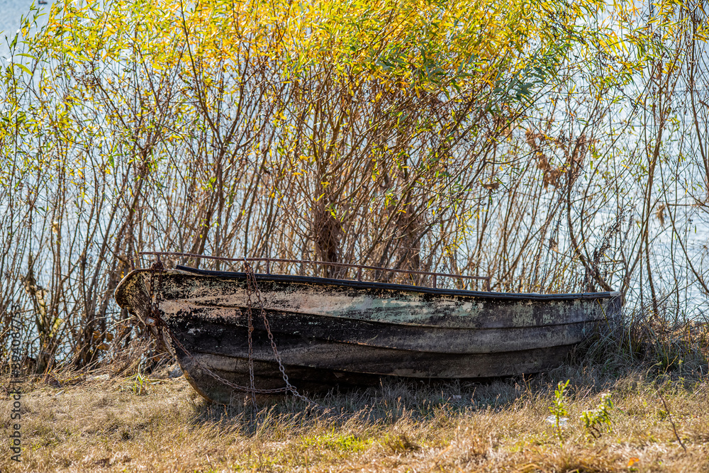 Fishing boat on the shore. Abandoned boat Fishing boat on the shore. Abandoned boat