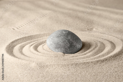 Circles on the sand and round stones in the rock garden  for relaxation and spiritual harmony