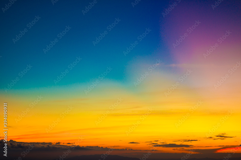 Colorful cumulus sunset sky clouds with sun setting down