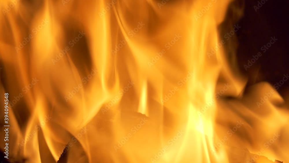 Slow motion. The flame of the fireplace. Burning wood in the fireplace. Close-up shooting. Slow motion. The flame of the fireplace. Burning wood in the fireplace. Close-up shooting.