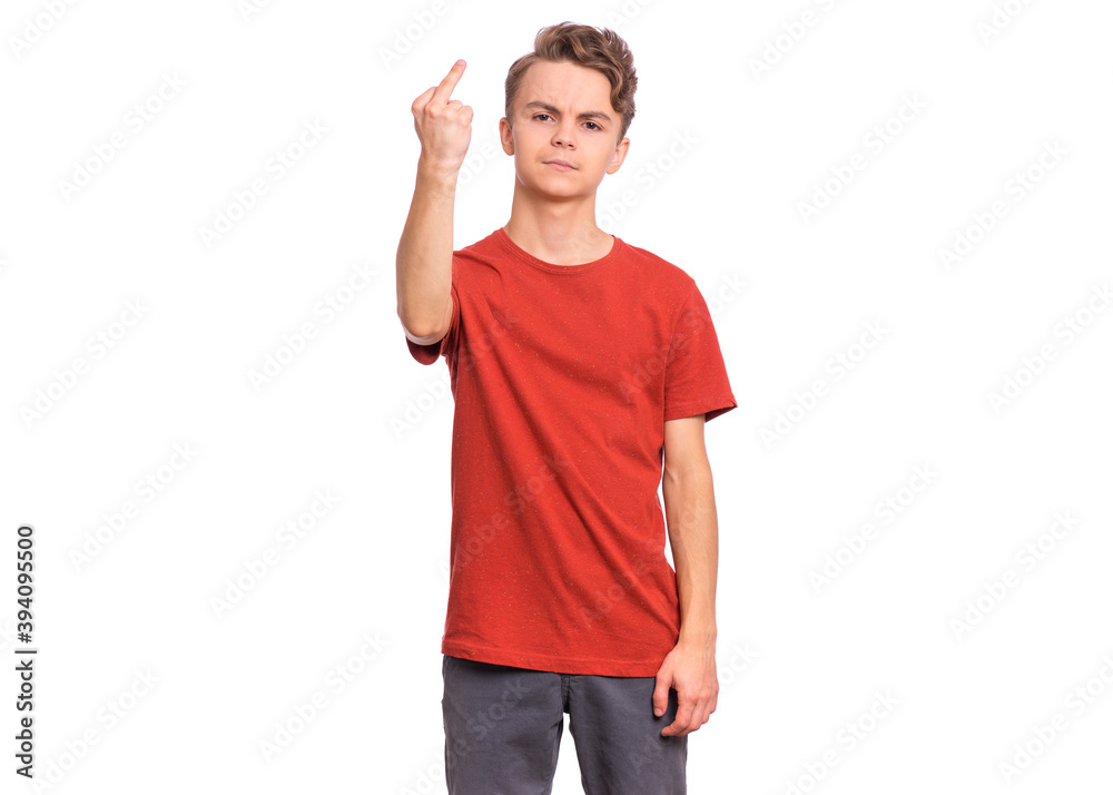 Portrait of angry teen boy showing middle fingers, isolated on white background Portrait of angry teen boy showing middle fingers, isolated on white background