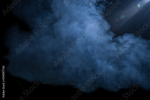 blue Smoke and dust on black background