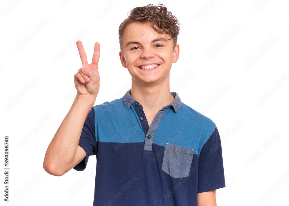 Handsome teen boy laughing looking very happy, isolated on white background. Handsome teen boy laughing looking very happy, isolated on white background.