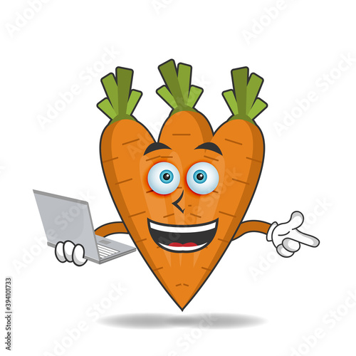 Carrot mascot character with laptop in right hand. vector illustration