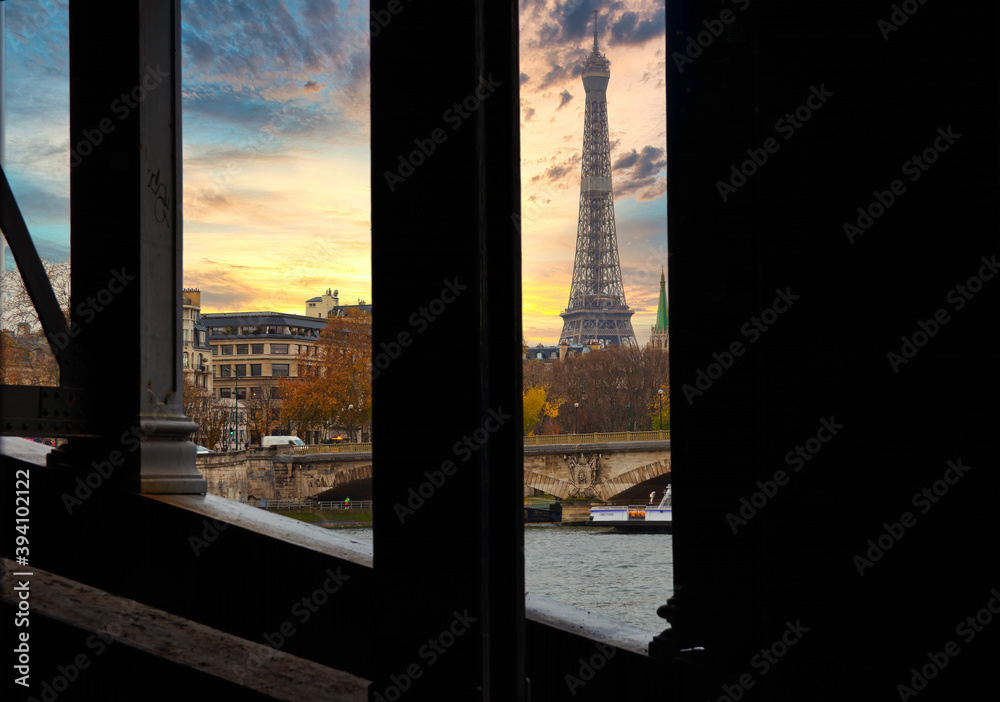 Paris, France - November 29, 2019 - Under a bridge the view of the Eiffel Tower