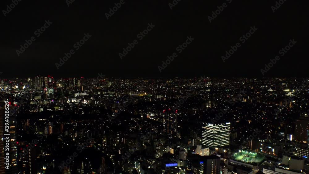 TOKYO, JAPAN : Aerial high angle sunrise CITYSCAPE of TOKYO. View of buildings around Shinjuku and Nakano ward. Japanese urban metropolis concept shot. Time lapse tracking shot night to morning. TOKYO, JAPAN : Aerial high angle sunrise CITYSCAPE of TOKYO. View of buildings around Shinjuku and Nakano ward. Japanese urban metropolis concept shot. Time lapse tracking shot night to morning.