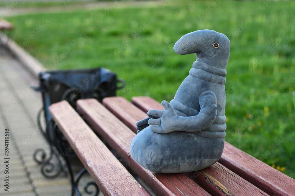 Homunculus loxodontus is sitting on the bench the garden waiting for ...