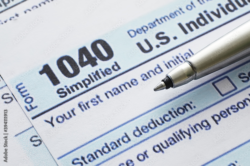 Annual tax reporting. Tax form on the table. Financial statements for signature. Annual tax reporting. Tax form on the table. Financial statements for signature.
