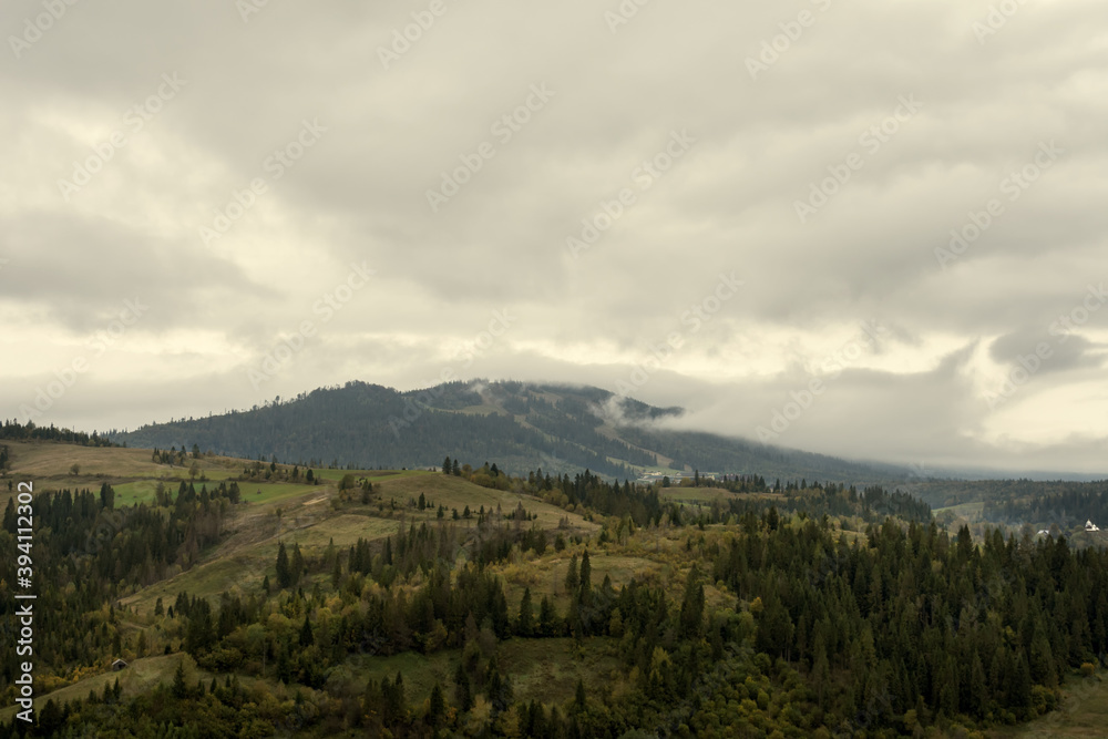 Beautiful mountain landscape with low clouds and morning fog. The Carpathians. Ukraine.