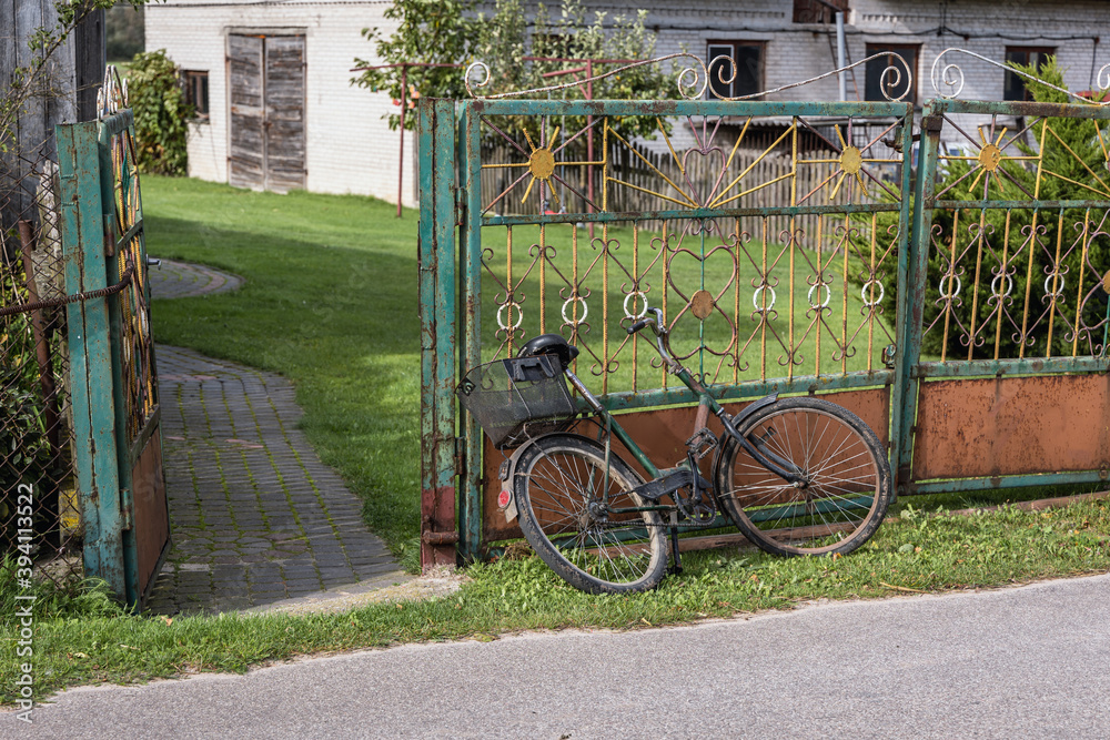 Old bicycle in a small village in rural area of Mazowsze region of Poland