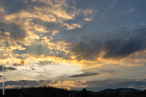 Beautiful clouds at sunset over the mountains. Nature.