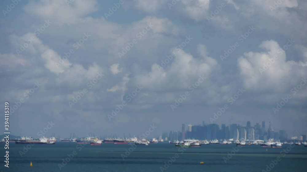 Singapore, port Singapore - June 30, 2020: Singapore city Marina Bay. Time lapse video. Shooting from the sea Singapore, port Singapore - June 30, 2020: Singapore city Marina Bay. Time lapse video. Shooting from the sea