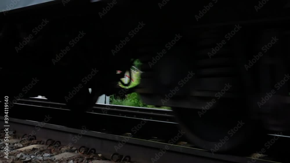 Arrival of the electric train on rails on gravel on camera Arrival of the electric train on rails on gravel on camera