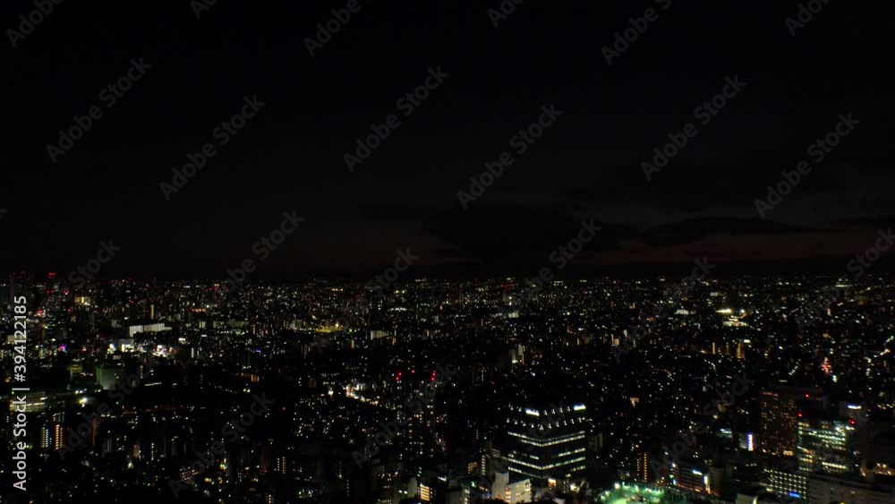 TOKYO, JAPAN : Aerial high angle sunrise CITYSCAPE of TOKYO. View of buildings around Shinjuku and Nakano ward. Japanese urban metropolis concept shot. Time lapse tracking shot night to morning. TOKYO, JAPAN : Aerial high angle sunrise CITYSCAPE of TOKYO. View of buildings around Shinjuku and Nakano ward. Japanese urban metropolis concept shot. Time lapse tracking shot night to morning.