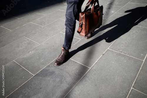 Man walking to work carrying a briefcase