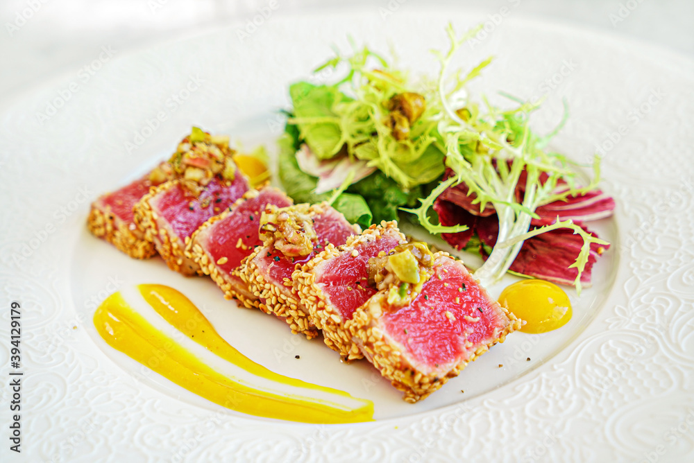 sliced tuna steak with sesame and vegetables