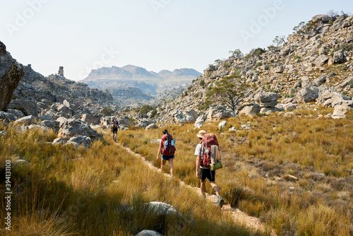 Hikers on a mountain trail photo