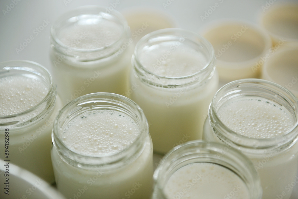 Cooked milk and containers, home made Cooked milk and containers, home made