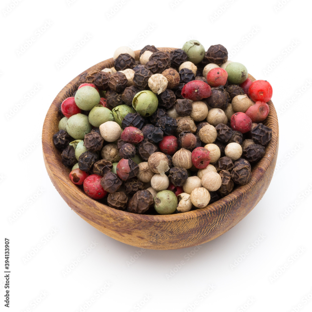 Pepper mix seed on spoon on white background. Pepper mix seed on spoon on white background.