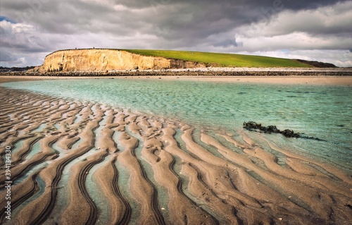 Obraz na płótnie Beautiful scenery of sand, water an mountain at Silverstrand beach in Galway, Ireland w salonie