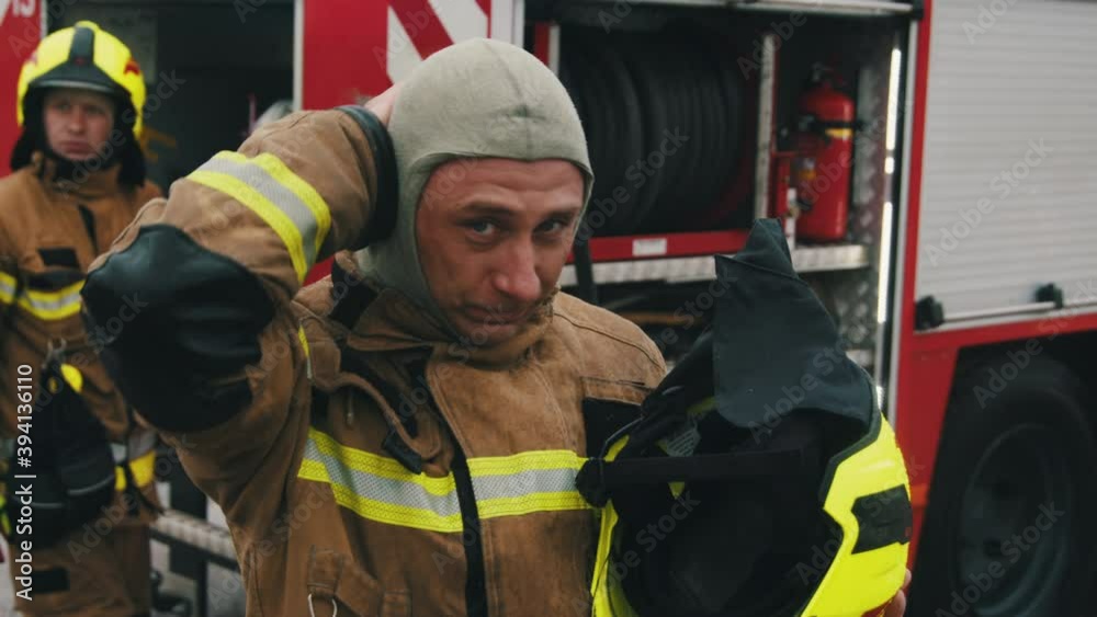 Portrait of the fireman in full uniform. High quality 4k footage Portrait of the fireman in full uniform. High quality 4k footage