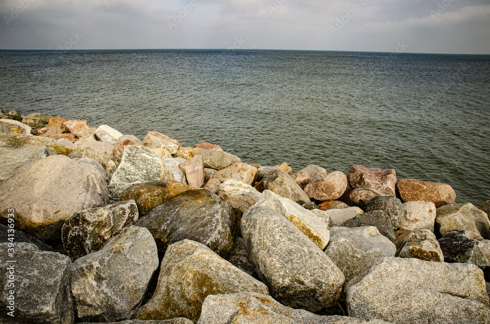 
view of huge stones by the sea on the beach