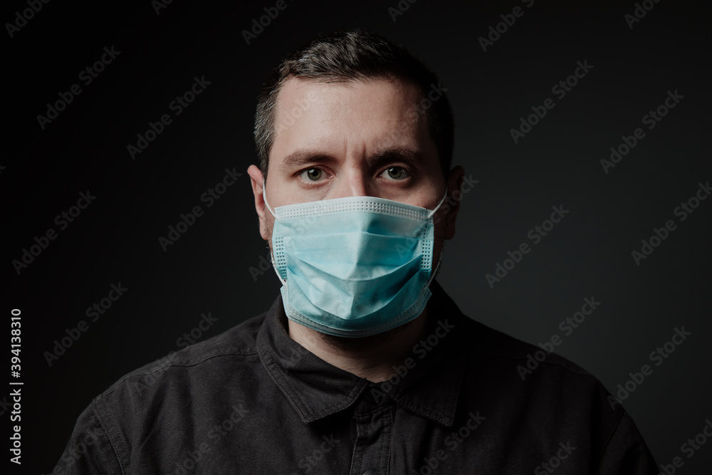 a man wearing a medical mask a man wearing a medical mask