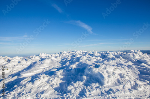 Closeup of frozen snow in heavy winter. details. © belyaaa