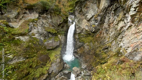 Waterfall and river in the mountains during autumn	 photo